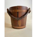 A vintage coopered wooden bucket with lift-out tin liner and rope twist handle, height 32cm.