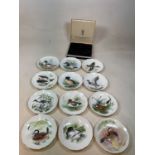 A set of twelve boxed limited edition Crown Staffordshire Peter Scott Wild Fowl Annual Collectors'