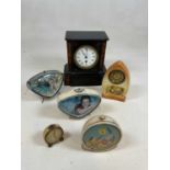 A late 19th century French black slate mantel clock and five other clocks including a Sooty &
