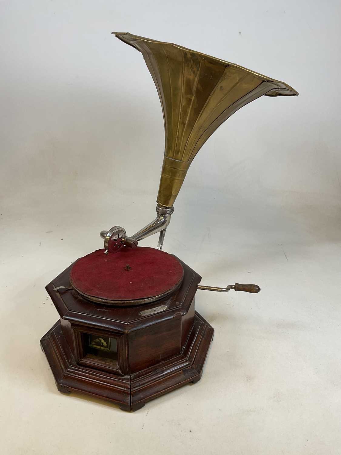 A gramophone bearing 'HMV' advertising plaque, sold with a brass horn.