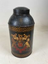 A toleware japanned tea canister with armorial painted to the front, height 45cm.