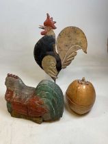 A naively constructed and painted model of a cockerel, and a carved wooden figure of a chicken and a