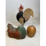 A naively constructed and painted model of a cockerel, and a carved wooden figure of a chicken and a