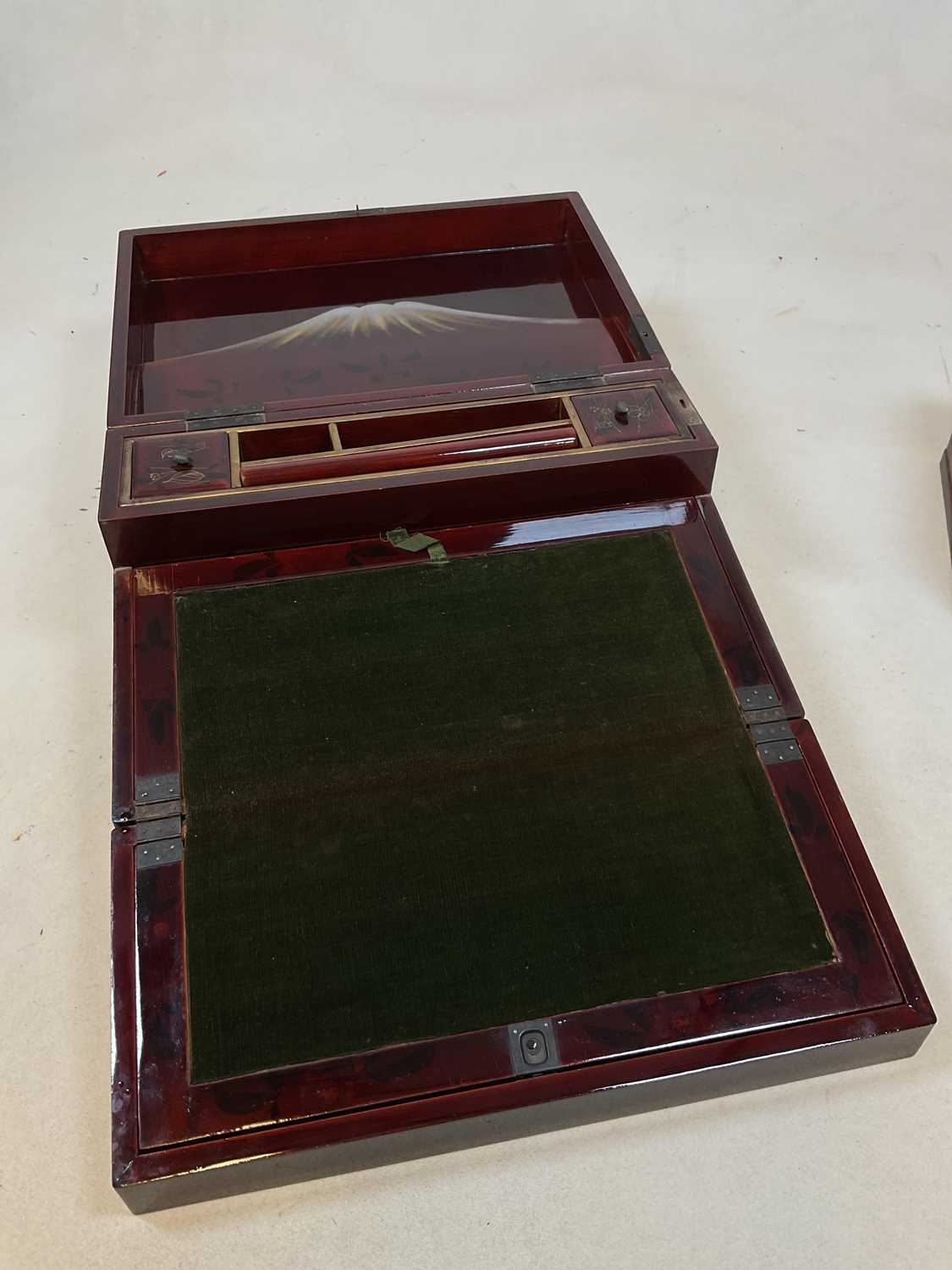 An early 20th century Japanese red lacquered and painted writing slope with hinged interior and - Image 3 of 10