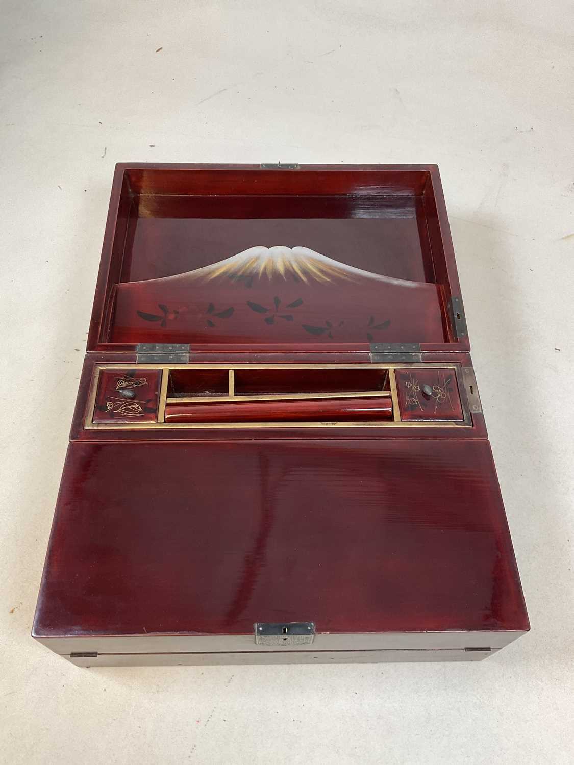 An early 20th century Japanese red lacquered and painted writing slope with hinged interior and - Image 5 of 10