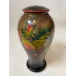 MOORCROFT; a large early flambe floral decorated baluster table lamp, signed to base with original