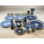 A quantity of Wedgwood jasperware including dark blue, light blue, black and green.