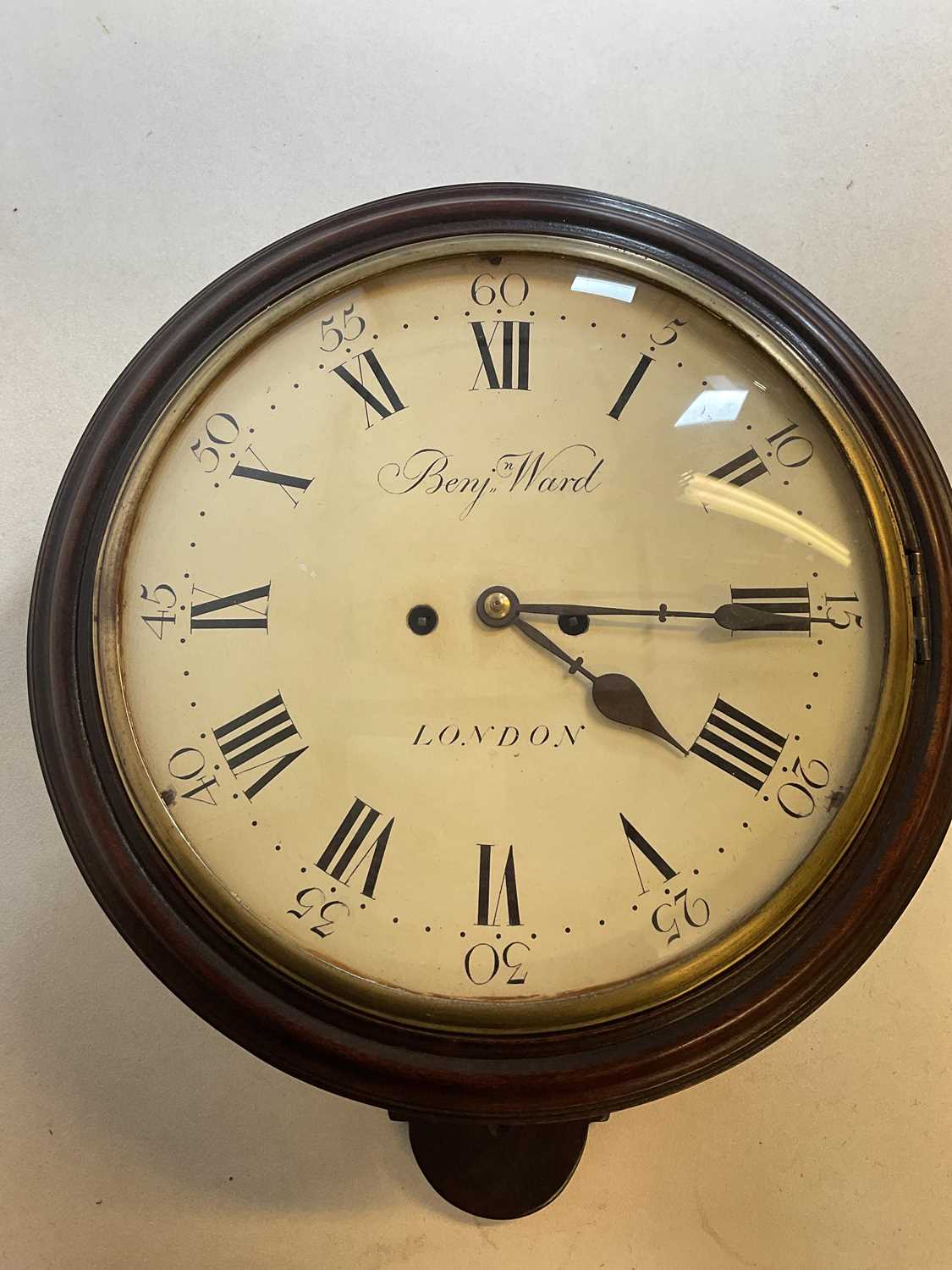 A rare 19th century mahogany cased circular wall clock, the repainted dial set with Roman numerals