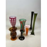 A Bohemian dark pink overlaid glass vase (chipped to foot), and five further vases and a candlestick