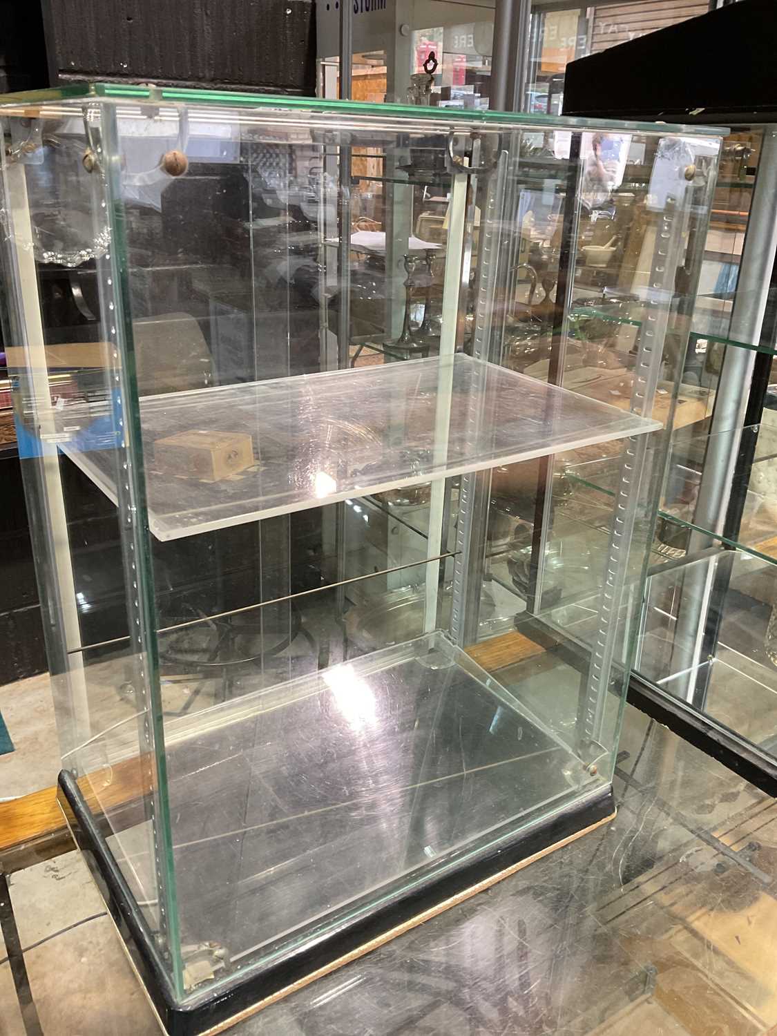 SEAL; a vintage glazed display cabinet with sliding rear door, height 62cm, width 45cm.