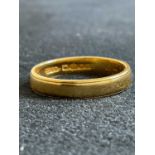A 22ct yellow gold wedding band, size L1/2, approx 3g.