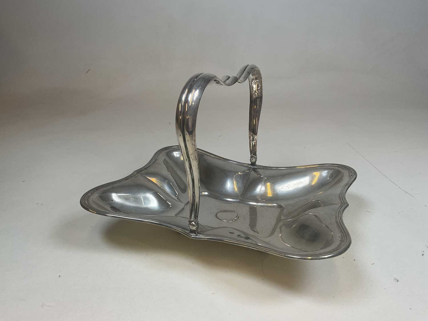 A late 19th century Austro-Hungarian silver swing handle basket of shaped rectangular form, raised