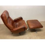 DE SEDE; an S-231 James Bond tan leather swivel chair with ottoman, purchased from Harrods circa