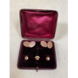 A leather cased gentleman's cufflink and shirt stud set, comprising a pair of 9ct yellow gold
