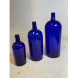 A graduated set of three early 20th century 'Bristol Blue' jars, the largest embossed '40' to the