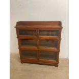 A Globe Wernicke style three tier bookcase, height 120cm, width 111cm, depth 32cm.