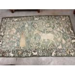 A contemporary wool rug in the style of William Morris, decorated with a unicorn, young girl, and