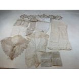 A collection of mainly antique lace items including two 19th century tippets, cuffs, lace borders