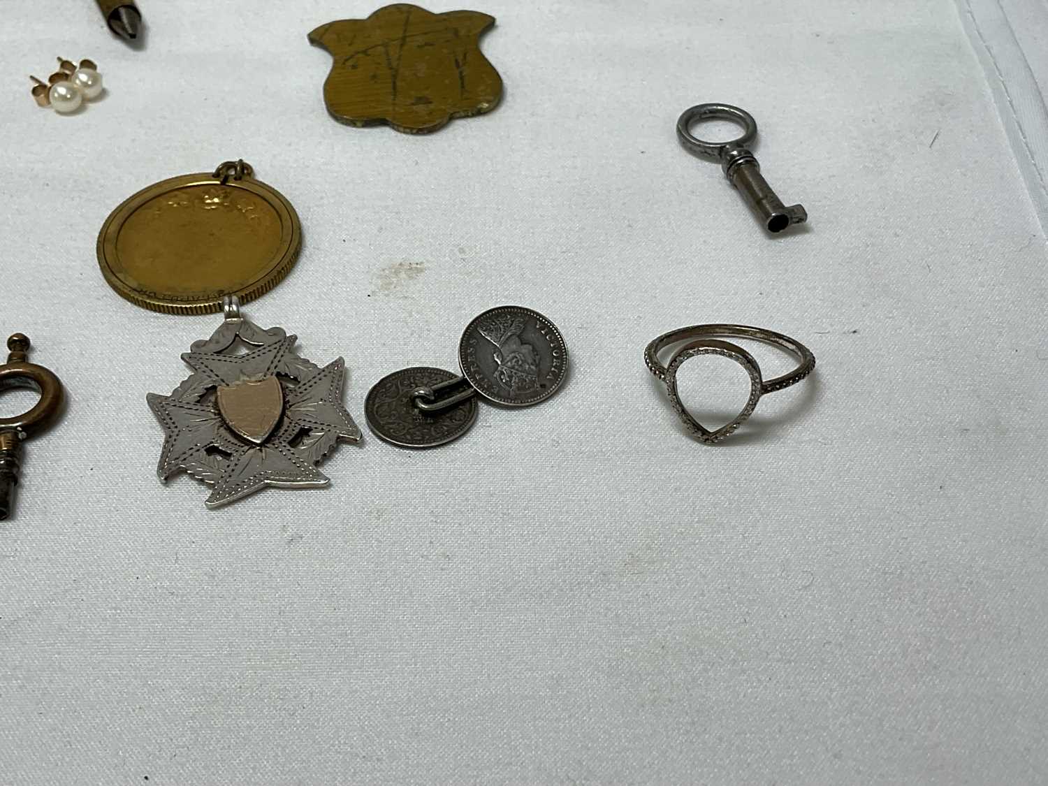 A collection of miscellaneous items to include four silver hallmarked spoons, gold and silver items, - Image 8 of 19