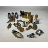 A group of shoe related items including Victorian hearth ornaments, pincushion, etc, also a model of