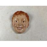 BESWICK; a face mask modelled as a young boy, 612, length 18.5cm.Condition Report: Some light