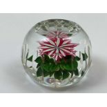 PERTHSHIRE; a dahlia flower weight with pink and white petals set in a faceted weight, above two