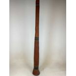 An Aboriginal didgeridoo with three bands of dot painted detail, height 147cm.