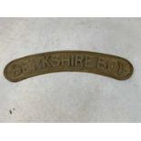 A cast brass curved sign inscribed 'Berkshire Boy', width 52.5cm.