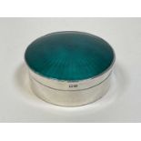 HENRY MATTHEWS; a George V hallmarked silver and green enamelled Art Deco small cylindrical box
