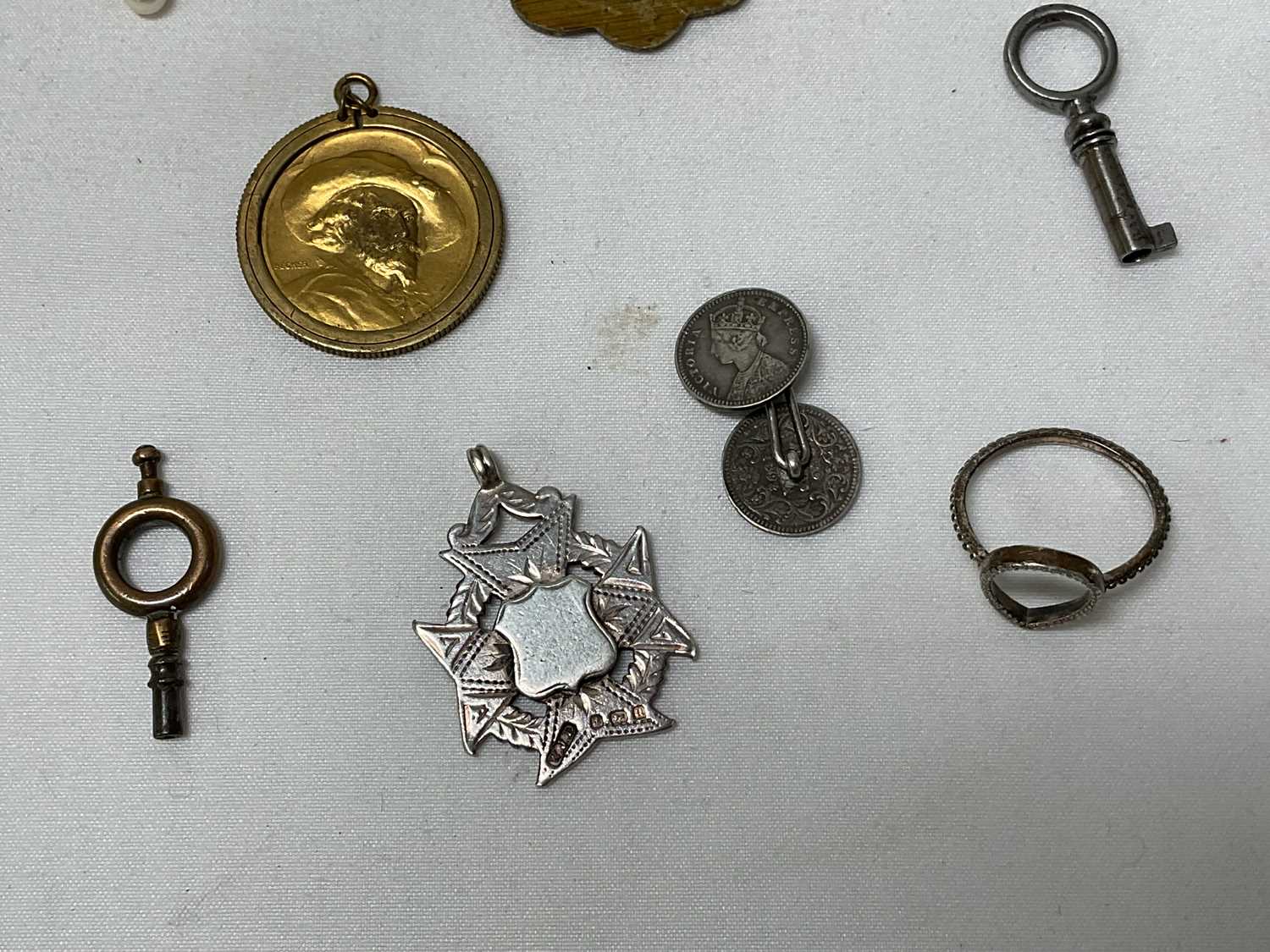 A collection of miscellaneous items to include four silver hallmarked spoons, gold and silver items, - Image 12 of 19