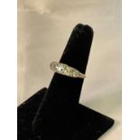 An 18ct yellow gold and graduated five stone diamond antique ring, the central stone weighing