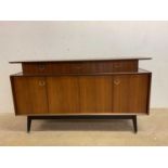 An E Gomme G plan sideboard and dining table; height 85cm, width 150cm, depth 46cm