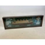 A model of the RMS Titanic in glass fronted display case, case height 33cm, width 106cm.