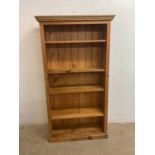 A large pine open shelf book case, height 175cm, width 100cm, depth 33cm.