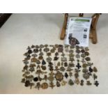 Approximately one hundred original military cap badges, including Royal Hampshire, Norfolk, West