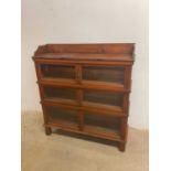 A Globe Wernicke style three tier bookcase with glazed front, height 120cm, width 111cm, depth