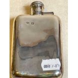 GOLDSMITHS & SILVERSMITHS COMPANY LTD; a George V hallmarked silver hip flask of slightly curved