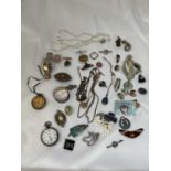 A group of costume jewellery including brooches and chains, also two pocket watches and a hallmarked