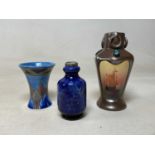 Three early 20th century British pottery vases, comprising Bretby pottery Art Nouveau form decorated