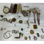 A collection of miscellaneous items to include four silver hallmarked spoons, gold and silver items,