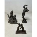 HEREDITIES; two bronzed resin semi-nude figures and a brass Oriental wrestling figure group, tallest