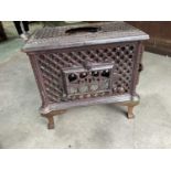 A circa 1900 French cast iron stove with pierced Gothic detail, length 55cm.