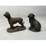 HEREDITIES; two bronzed resin dogs, largest 14cm high.