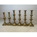 Three large pairs of Victorian brass candlesticks, comprising two pairs of diamond pattern sticks,