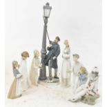 A group of five Lladro figures and two Nao figures (7).