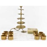 An Indian brass five tier candlestick, a set of twelve napkin rings, and onyx box (3).