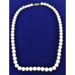 An Indian hand tied pearl and yellow gold necklace, length 50cm.