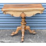 A Victorian walnut card table with fold over swivel top, width 92cm (faded).