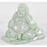 A Chinese jade carving of a seated Buddha, height 10cm.