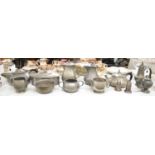Two hammered pewter tea services comprising two teapots, two sugar bowls, cream jugs, two coffee